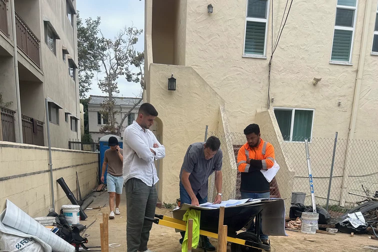 UBIC crew reviewing plans on a Los Angeles construction site